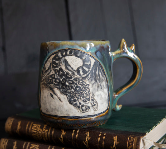 Snow leopard and mountains ceramic mug. Handmade, one of a kind. Unique pottery