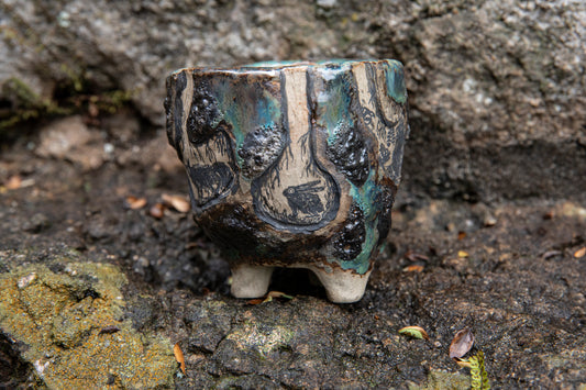 Cute ceramic flower pot with various animals in their burrows underground, unique, one of a kind