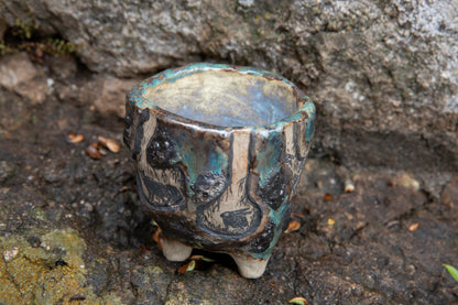 Cute ceramic flower pot with various animals in their burrows underground, unique, one of a kind