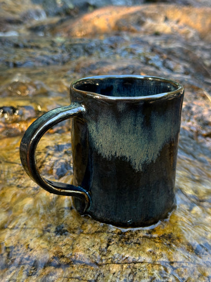 Whale and small boat with little girl in the sea, ceramic mug