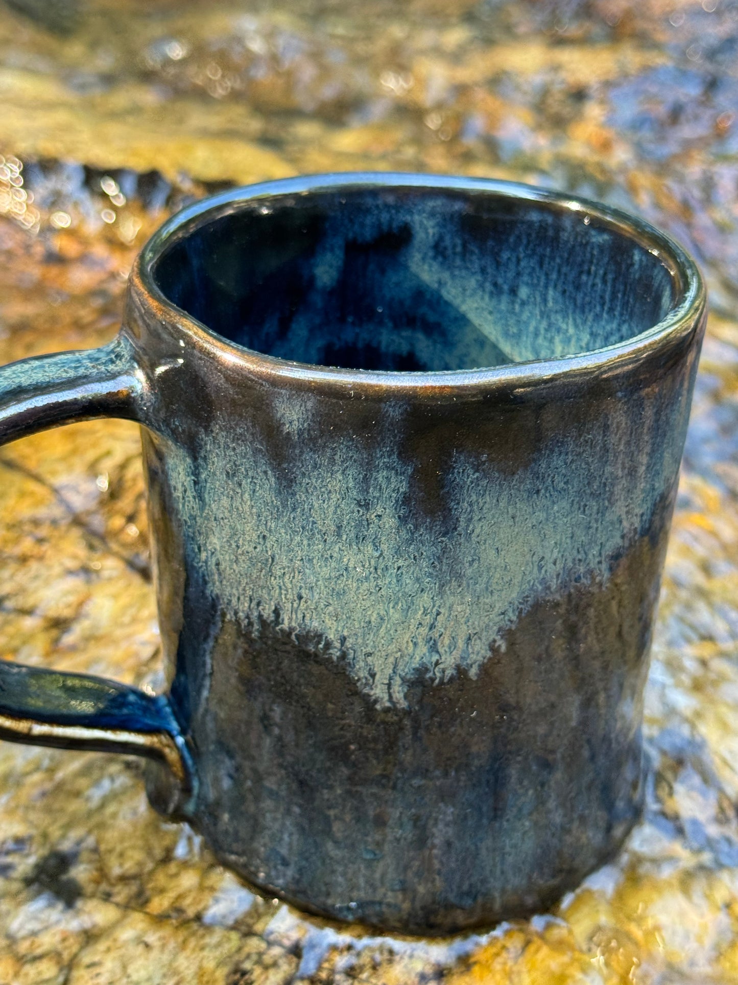 Whale and small boat with little girl in the sea, ceramic mug