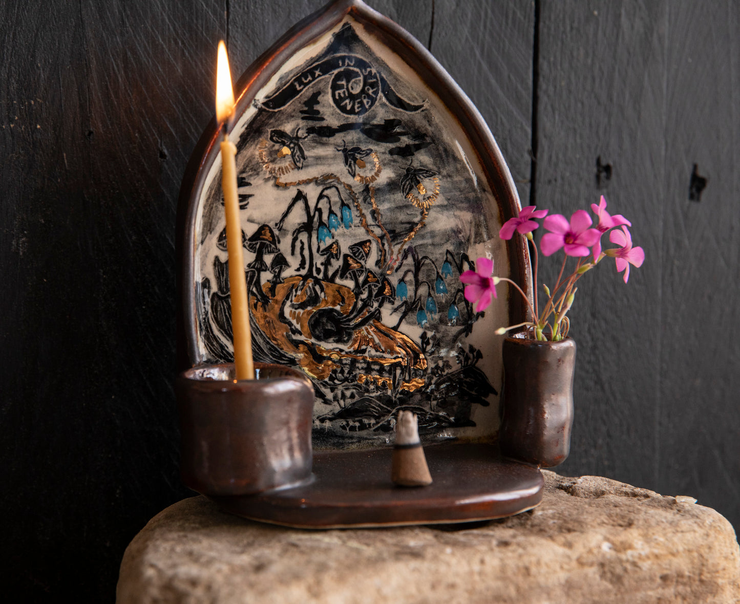 Altar Light in the darkness, firefly and flowers and dog scull