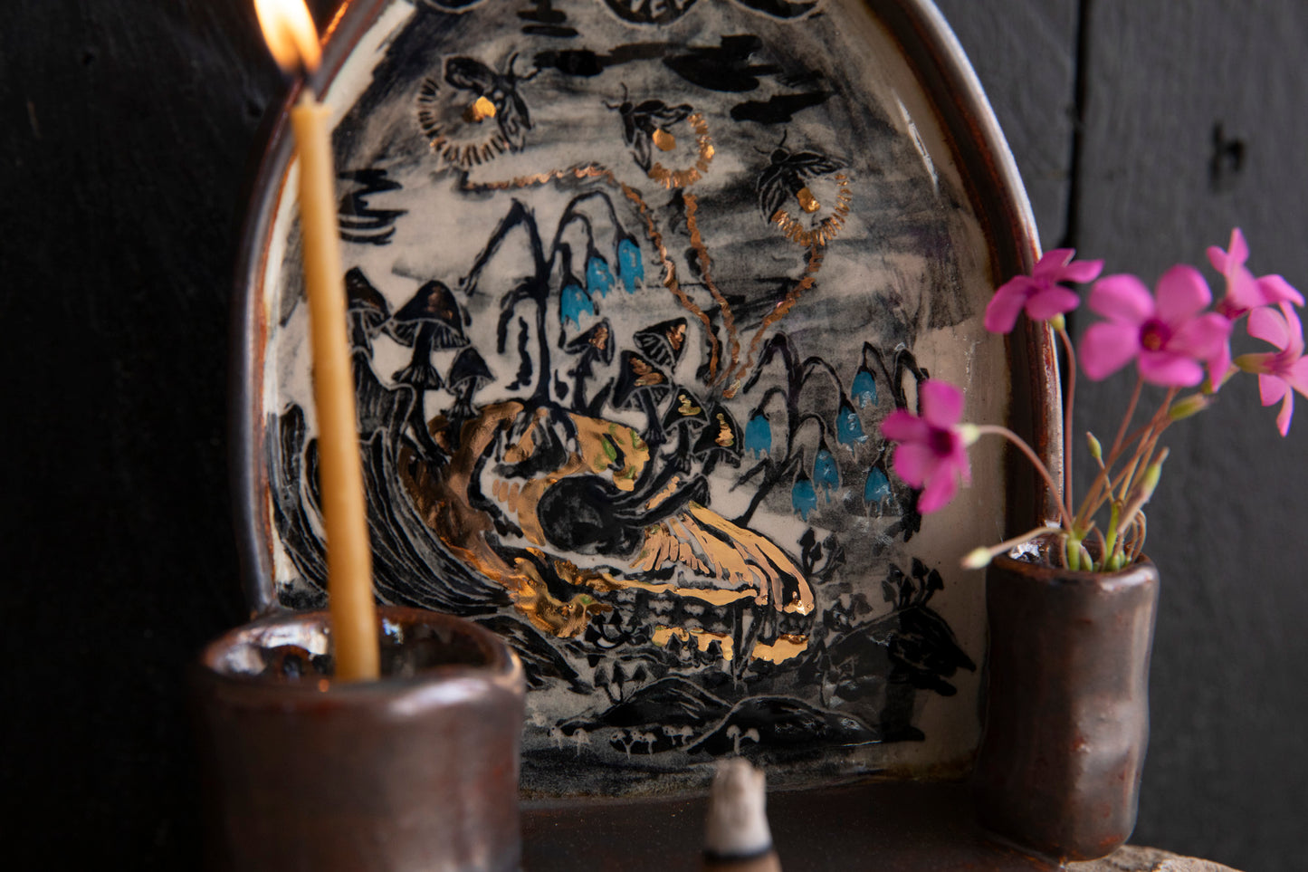Altar Light in the darkness, firefly and flowers and dog scull