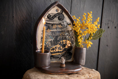Altar Light in the darkness, firefly and flowers and dog scull